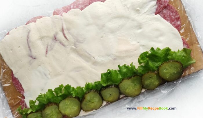 Smoky Salami Cream Cheese Appetizer recipe idea for Christmas and parties. An easy cold roll up on skewer stick with pickles.