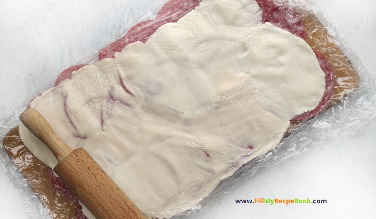 Smoky Salami Cream Cheese Appetizer recipe idea for Christmas and parties. An easy cold roll up on skewer stick with pickles.