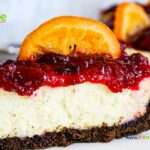 Chocolate Crusted Cranberry Orange Cheesecake recipe idea to create for thanksgiving or Christmas, cookie base oven bake dessert.