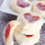 Strawberry Heart Thumbprint Cookies Recipe. A simple, festive cookie made with an easy dough and filled with sweet strawberry jam or puree.