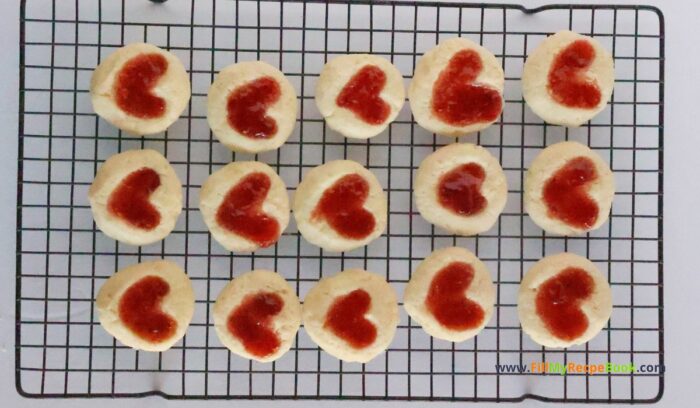 Strawberry Heart Thumbprint Cookies recipe. An easy dough mix idea and strawberry jam or puree filling for a snack at Christmas holidays.