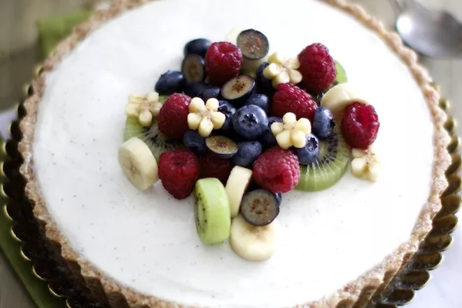 A Tart with strained Greek yogurt. The crust is entirely raw – made of almond, coconut flakes and hemp seeds. This healthy dessert is easy to make and can be stored in freezer for 10 to 15 days. 