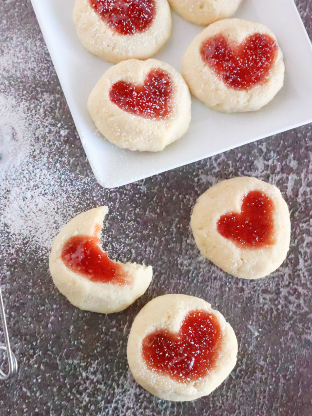 Strawberry Heart Thumbprint Cookies recipe. An easy dough mix idea and strawberry jam or puree filling for a snack at Christmas holidays.