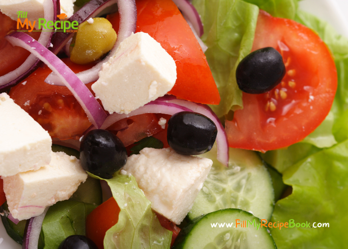 Best Greek Salad Recipe with a dressing, tossed together with lettuce. An easy and crunchy cold side dish in a bowl for braai, barbecue meals.