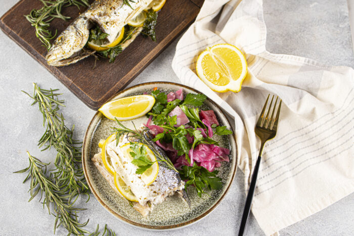 Simple Oven Baked Sea Bass Recipe idea. A whole fresh sea bass fish baked in a dish for a healthy dinner or lunch with sides of choice.