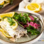 Simple Oven Baked Sea Bass Recipe idea. A whole fresh sea bass fish baked in a dish for a healthy dinner or lunch with sides of choice.