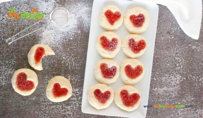 Strawberry Heart Thumbprint Cookies recipe. An easy dough mix idea and strawberry jam or puree filling for a snack at Christmas holidays.