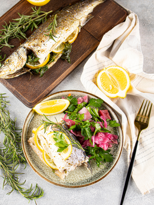 Simple Oven Baked Sea Bass Recipe idea. A whole fresh sea bass fish baked in a dish for a healthy dinner or lunch with sides of choice.