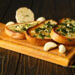 The Best Toasted Garlic Bread Slices recipe idea. Easy homemade loaf slices buttered with garlic butter mix and herbs toasted in the oven.