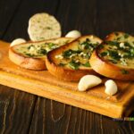 The Best Toasted Garlic Bread Slices recipe idea. Easy homemade loaf slices buttered with garlic butter mix and herbs toasted in the oven.