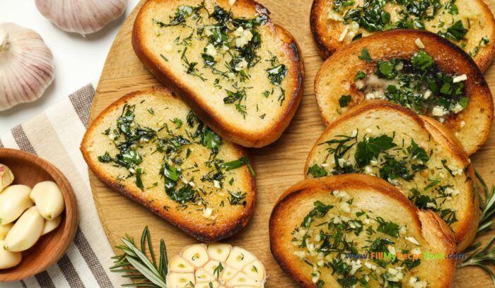 The Best Toasted Garlic Bread Slices recipe idea. Easy homemade loaf slices buttered with garlic butter mix and herbs toasted in the oven.