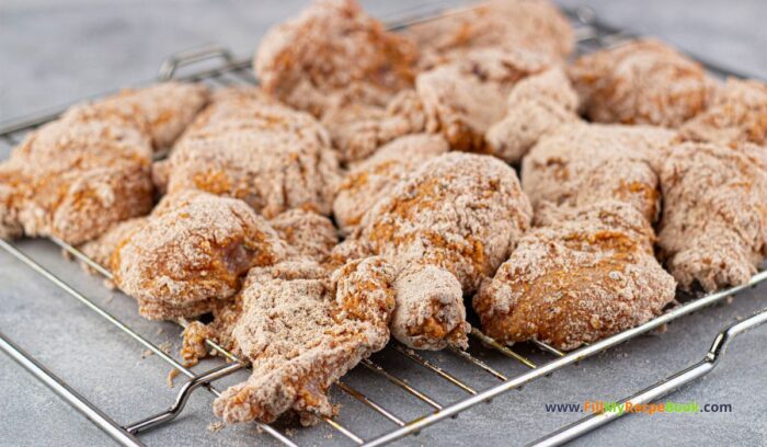 chicken pieces battered resting for a few minutes, This Easy Homemade KFC Fried Chicken recipe idea. Tasty chicken pieces fried in a batter with spices for a home meal for family lunch or dinner. 