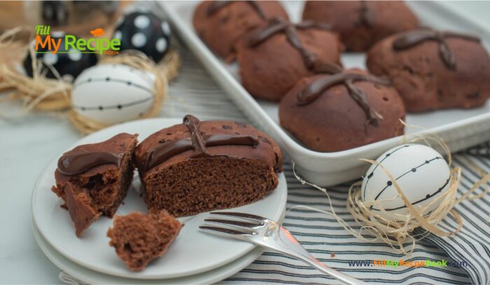 Chocolate Orange Hot Cross Buns recipe idea with a twist. A bread machine dough mix, oven baked buns orange glazed for Easter.