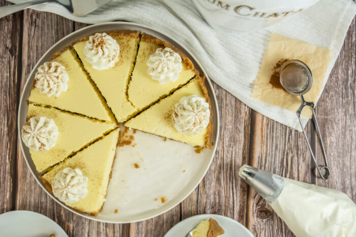 Easy Rumchata Cheesecake Recipe idea. Oven Baked with biscuit base and creamy liqueur flavor with cinnamon and cream topping for dessert.