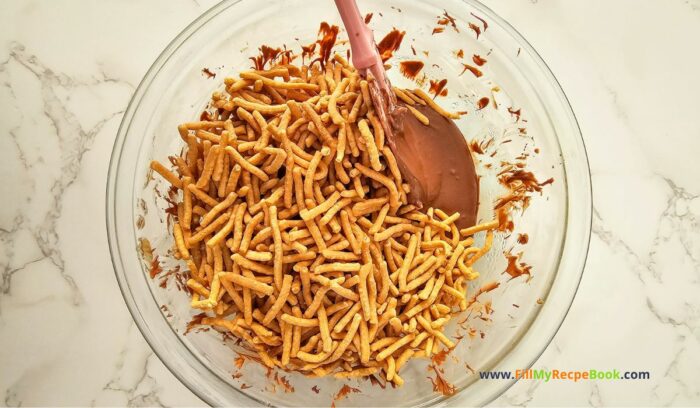 Easter Nest Haystack Treats recipe for snacks. Easy enough for kids to help make, with a chocolate nest and mini candy colorful coated eggs.