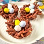 Easter Nest Haystack Treats recipe for snacks. Easy enough for kids to help make, with a chocolate nest and mini candy colorful coated eggs.