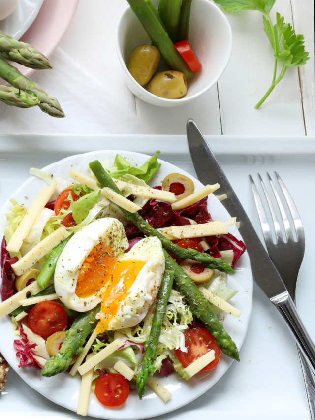 Easter Holiday Spring Breakfast Salad recipe idea. A healthy easy bowl of salad for brunch with egg and sautéed asparagus with a dressing.