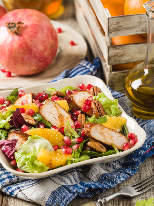 Spring Salad Chicken Pomegranate Honey recipe idea for summer or spring. Healthy side dish has orange, nuts, lettuce and a drizzle of honey.
