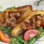 Beef Philly Cheesesteak Sandwich Pockets recipe idea for lunch. Caramelized onions, pan fried bread pockets filled with juicy steak strips.
