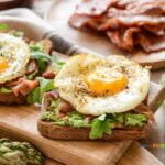Toast Fried Egg Bacon and Arugula recipe idea for a breakfast or brunch meal. An easy no bake stove top recipe to make for two.