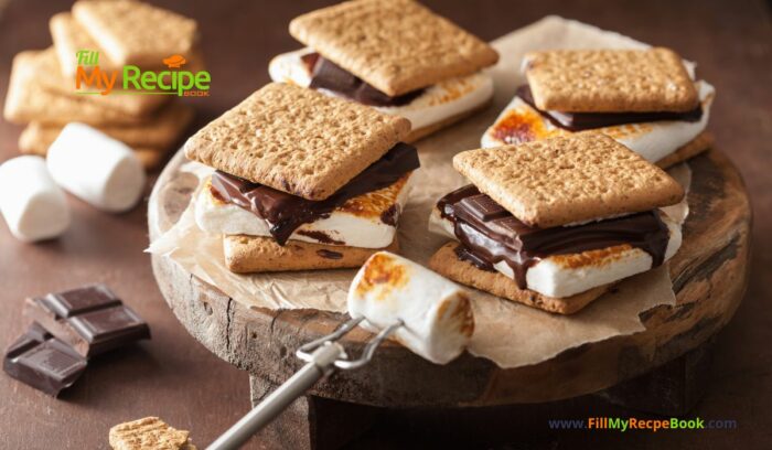 Homemade Marshmallow s’mores with Chocolate and crackers recipe idea. Melted marshmallows on the open fire while camping in spring or summer.