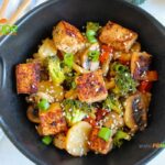 Easy Tofu Veggie Stir Fry Recipe idea with honey and sesame seeds. A no bake healthy vegan or vegetarian meal with udon noodles.
