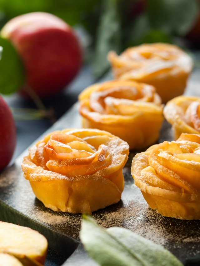 Mini Apple Rose Tarts recipe. A simple but delicious sweet apple oven baked apple pie or tart for a dessert garnished with castor sugar.