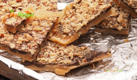 Homemade Chocolate Toffee Almond Bars on a shortbread base recipe. An easy candy topped cookie bar that taste like toffee, with nuts for snacks.