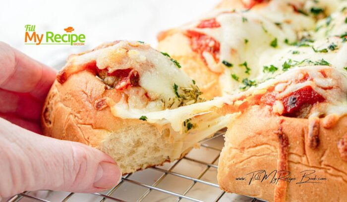 Easy Pull Apart Meatball Sliders recipe. Use Hawaiian rolls, cheese, and drizzle with garlic, Italian herbs in butter before baking in oven.