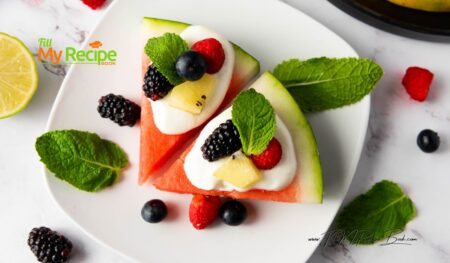 Easy, healthy watermelon berry pizza recipe topped with Greek yogurt and honey, made in minutes with no added sugars for snacks.
