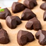 A delicious creamy Nutella and blended hazelnuts filled bonbons, coated in a hard chocolate molded into heart shapes. An attractive dessert or snack for many occasions. Valentines or Mothers or Fathers Day, gift ideas. Simple enough for kids to make with adult help.