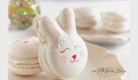 Cute Easter Bunny Macarons Recipe idea for dessert. An Oven Baked homemade design and decorated face with ears, filled with whipped white chocolate ganache