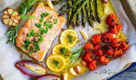 Savor this Easy Sheet Pan Salmon and Asparagus dish. A delightful, all in one healthy dinner featuring cherry tomatoes, garlic, touch of lemon.