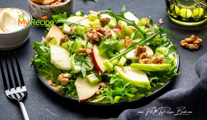 Healthy Waldorf Salad Recipe idea for lunch. Crunchy, freshness of crispy apples, lettuce, and celery topped with walnuts for a family.