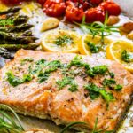 Savor this Easy Sheet Pan Salmon and Asparagus dish. A delightful, all in one healthy dinner featuring cherry tomatoes, garlic, touch of lemon.