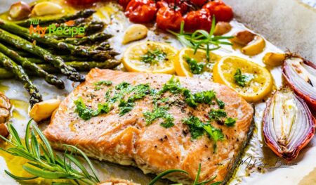 Savor this Easy Sheet Pan Salmon and Asparagus dish. A delightful, all in one healthy dinner featuring cherry tomatoes, garlic, touch of lemon.