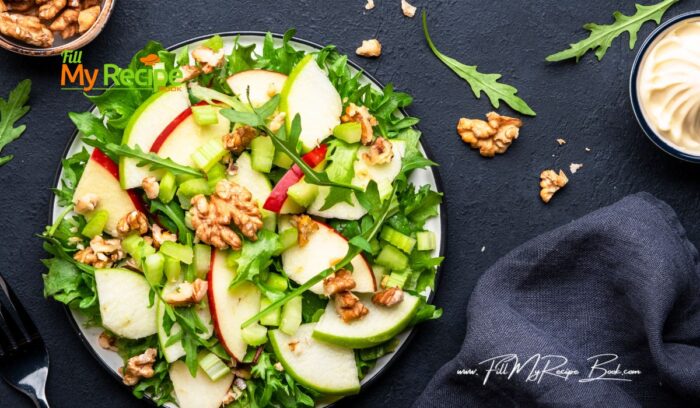 Healthy Waldorf Salad Recipe idea for lunch. Crunchy, freshness of crispy apples, lettuce, and celery topped with walnuts for a family.