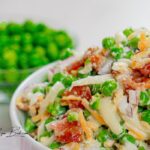 Create a Easy Pea Salad with Bacon recipe, featuring cheese and dressed with mayonnaise, perfect as a refreshing cold green summer salad.