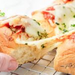 Easy Pull Apart Meatball Sliders recipe. Use Hawaiian rolls, cheese, and drizzle with garlic, Italian herbs in butter before baking in oven.