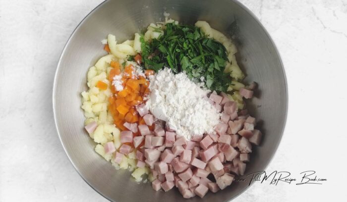 In a mixing bowl, combine the mashed potatoes, starch, chopped herbs, ham and carrots. Stir to combine. The mixture should be thick and slightly sticky.