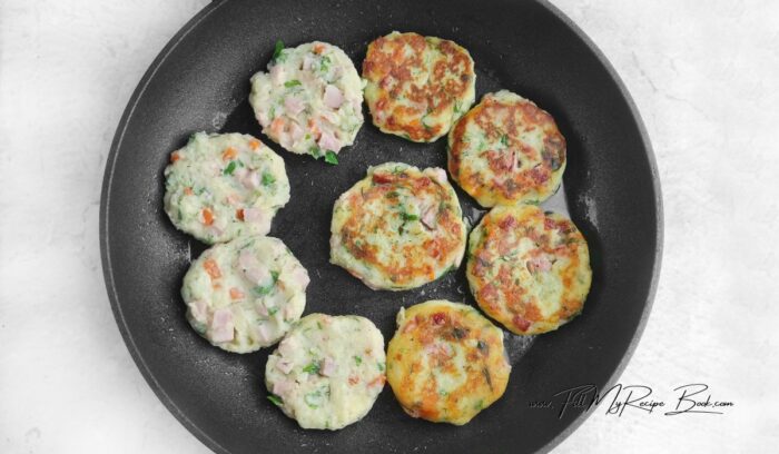 Heat a skillet over medium heat. Add a little olive oil or use cooking spray to lightly grease the surface. Place the items on the skillet. Fry the pancakes for 3-4 minutes until golden. Carefully flip the potato cakes once they golden underneath with a spatula and cook for another 3-4 minutes on the other side.