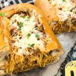 Easy Spaghetti Stuffed Garlic Bread recipe. Easy and quick oven bake or grill loaf filled with ground beef and pasta sauce, with cheese.