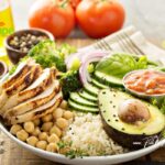 Simply healthy delicious Grilled Chicken Rice Lunch Bowl with chickpeas, broccoli and salad recipe. Easy idea for a weeknight meals, lunch.
