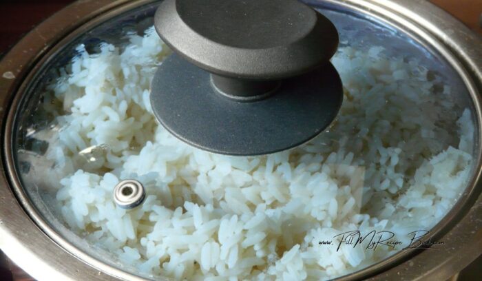Add you cup of rice to a pot and then add two and half cups of water and salt to the rice and bring to boil. Turn down the heat to simmer and add a lid to the rice pot. leave for a good 10 minutes or so until the water has been absorbed. The rice will be ready. (use a rice cooker if preferred)