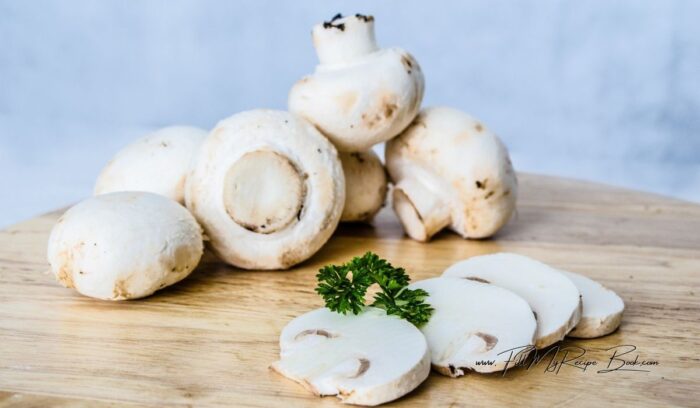 Clean and slice the button mushrooms and the onion, finely. for this mushroom and corn puff pastry tartlet.