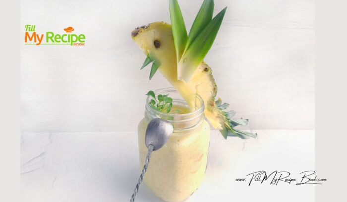 Place ice in a glass, add the smoothie. Sit the bird of paradise on the rim of the glass. Add some microgreen and serve the smoothie to the table.