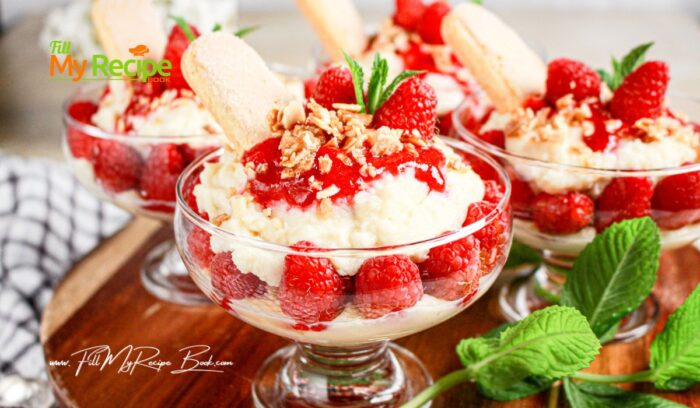 Repeat the layers: ladyfingers – cream – almonds. Finish with a swirl of extra coulis and sprinkle of almond crunch and a couple fresh berries.