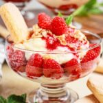 Raspberry White Chocolate Tiramisu in a Glass recipe for a dessert. Delicious creamy layers of mascarpone with syrupy soaked ladyfingers.