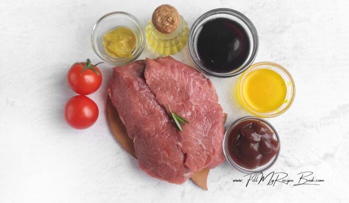 Ingredients for Juicy Steak and Tomato Kebabs.
strip loin or tender steak, cherry tomatoes, olive oil, salt and pepper, greens for serving, balsamic cream, barbecue sauce, honey and mustard.