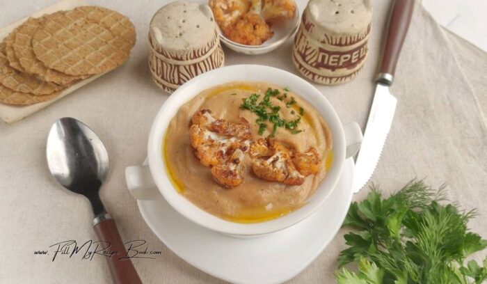 Ladle the soup into bowls. Garnish with flower buds, herbs of parsley, and olive oil. Bon appétit!